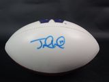 a close up of a white football with blue writing on it