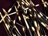 a lot of toothpicks that are laying on a table