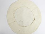 a picture of a circular piece of paper with a hole in it