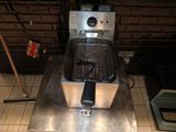 a deep fryer sitting on a counter in a kitchen