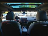 two seats in the back of a car with a view of a parking lot
