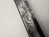 a knife that is laying on top of a table