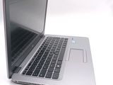 a close up of a laptop computer on a white surface