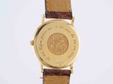 an image of a close up of a watch on a white surface