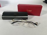 pair of glasses and case on a white surface with a red box in the background