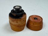 two wooden objects that are sitting on a white surface