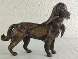 a statue of a dog that is standing on a table