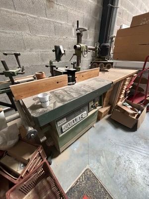 a picture of a workbench in a workshop with a lot of tools