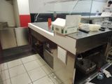 an image of a restaurant kitchen with a counter and a counter top