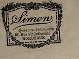 a picture of a sign on a wall that says simon