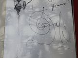 someone signed a book with a drawing of a bird on it