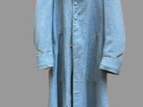 blue wool coat on a hanger on a gray background