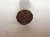 an image of a wax stamp with the letter d on it