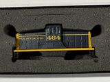 a black and yellow train on display in a box