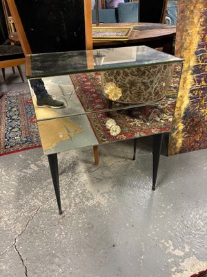 a glass table with a mirror on top of it