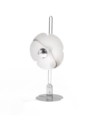 a white lamp that is on a stand on a white surface