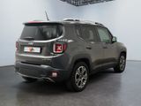 the back end of a grey jeep compass parked in a garage