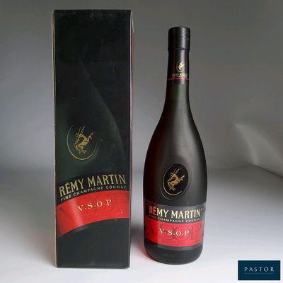 a bottle of wine that is next to a box
