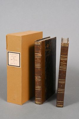two books are sitting next to each other on a table