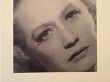 an old black and white photo of a woman with blonde hair