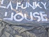 a sign that says i ' m funkyy house on a tarp