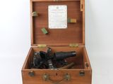 a wooden box with a bunch of hair dryers inside of it