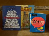 three books that are sitting on a table
