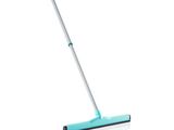 a close up of a mop on a white surface
