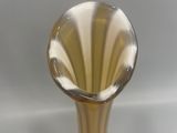 a glass vase that is sitting on a table