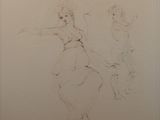 a drawing of two people on the wall of a bathroom