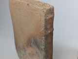 these are two pieces of clay that are sitting on a table