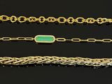 four different types of bracelets on a black surface