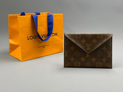 two louis vuitton bags, one brown and one orange