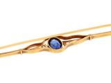 an image of a close up of a hair pin with a blue stone