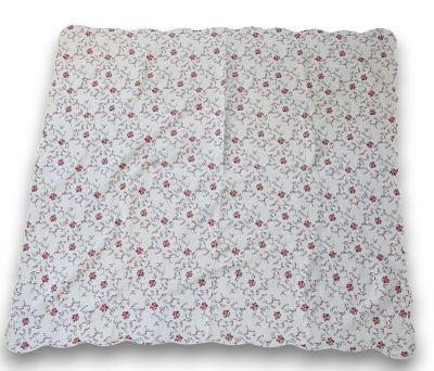 a close up of a pillow with a flower pattern on it