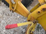 a close up of a yellow wheel with a red handle
