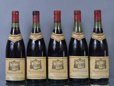 six bottles of wine are lined up in a row on a table
