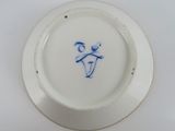 a white plate with a blue design on it