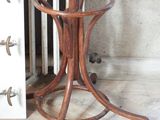 a wooden table with a glass top on a wooden floor