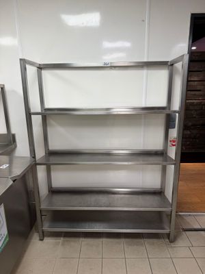 stainless steel shelvings in a commercial kitchen with a tiled floor