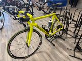 a yellow bike that is on display in a store