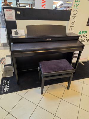 a piano and a stool in a store with a mirror