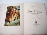 an open book with a picture of a woman in a long dress
