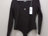 black long sleeved bodysuit with a pocket on a hanger