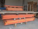 a pile of lumber in a warehouse next to a pallet