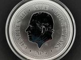 un gros plan d'une pièce de monnaie sur laquelle figure le visage d'un homme