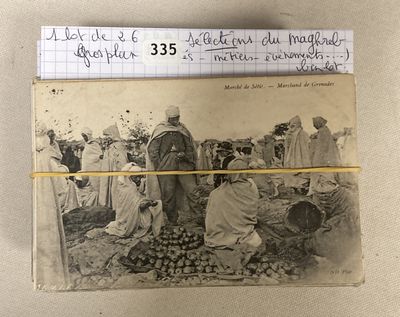 an old black and white photo of a group of people at a market