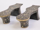 pair of antique wooden foot stools with black and gold designs