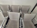 many chairs that are sitting in the middle of a room