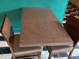 a table and two chairs in a room